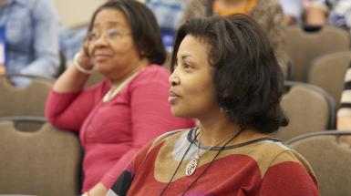 2 women listening to presentation