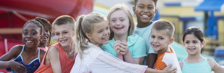 children hugging on the playground