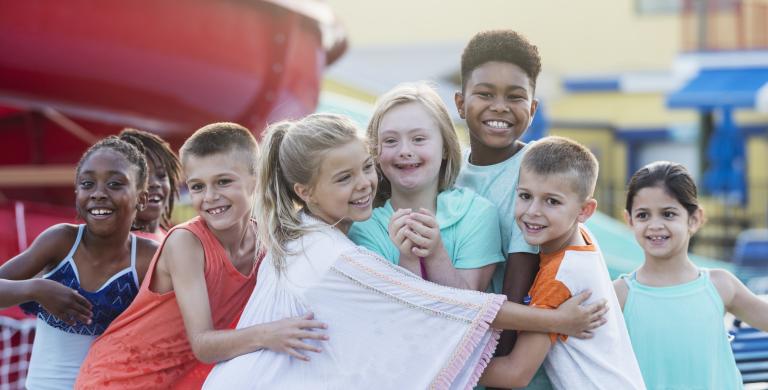 children hugging on the playground