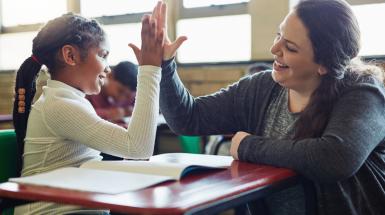 woman and girl high fiving