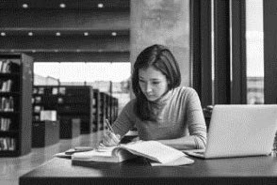 woman reading in library