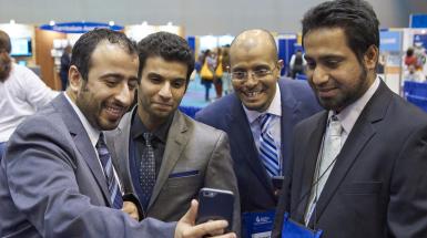Group of male members smiling together in selfie