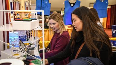 Two women working on a project together
